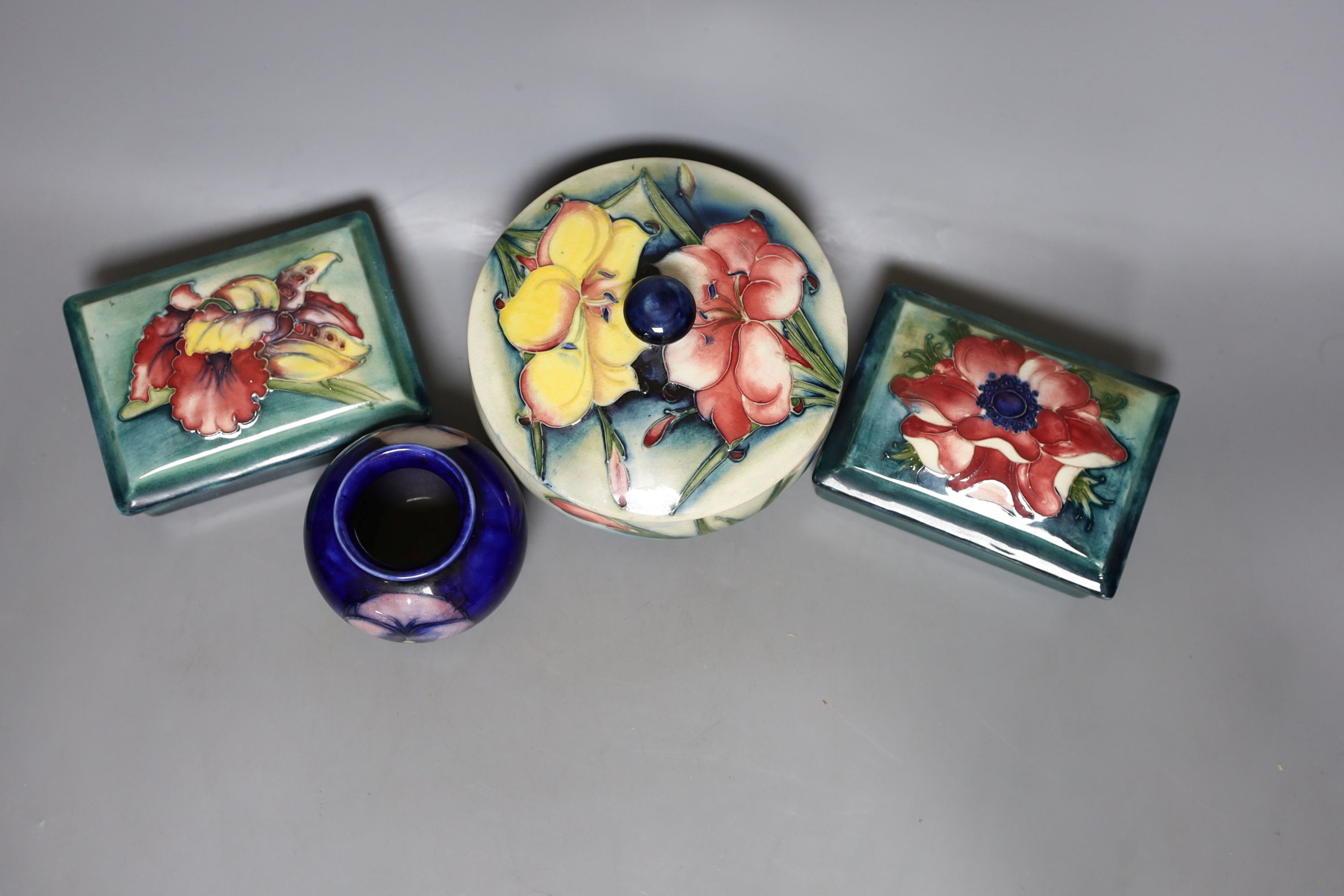 A pair of Moorcroft boxes with covers, together two other moorcroft pots (4)